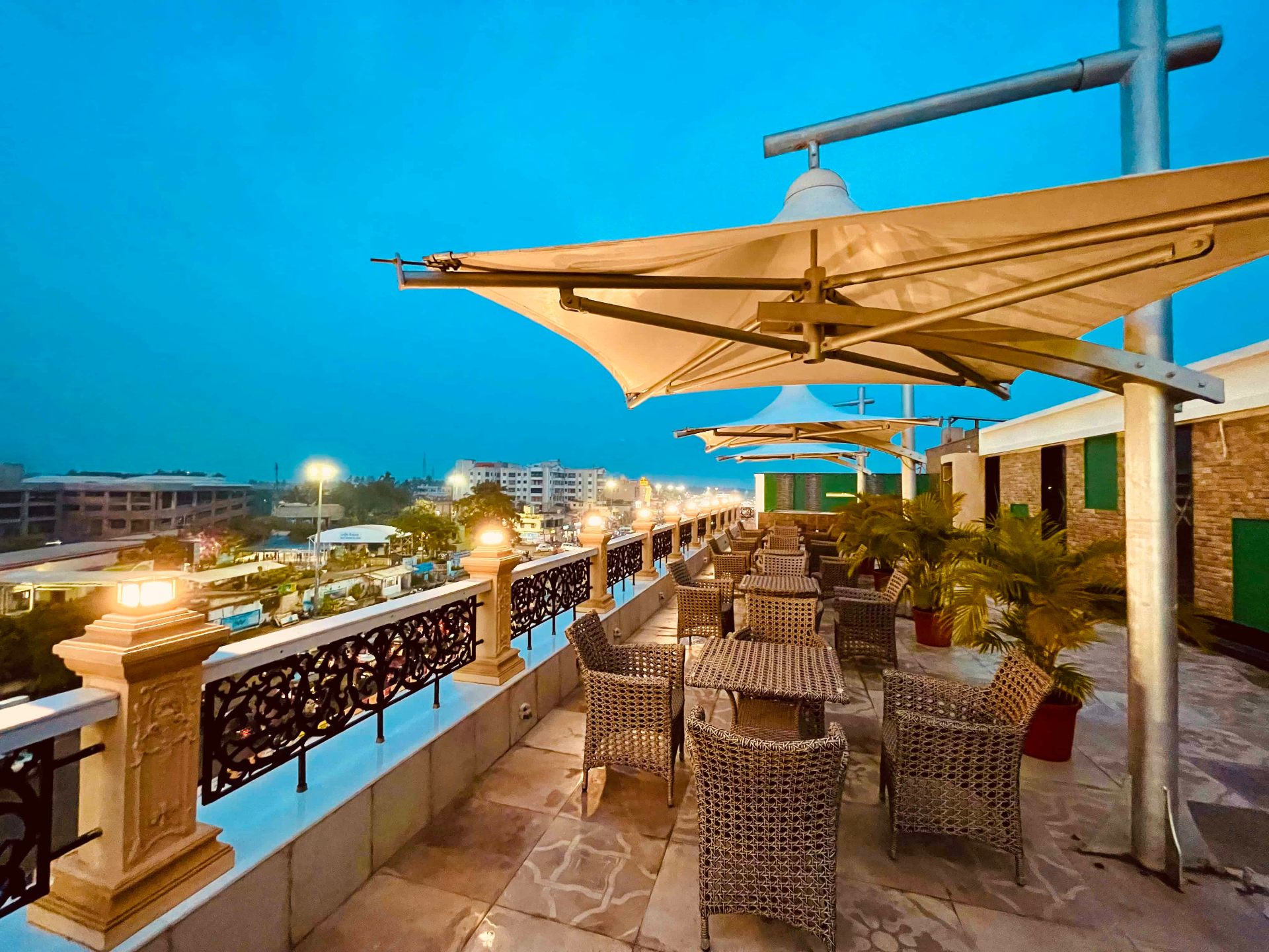 Rooftop cafe with city view at dusk